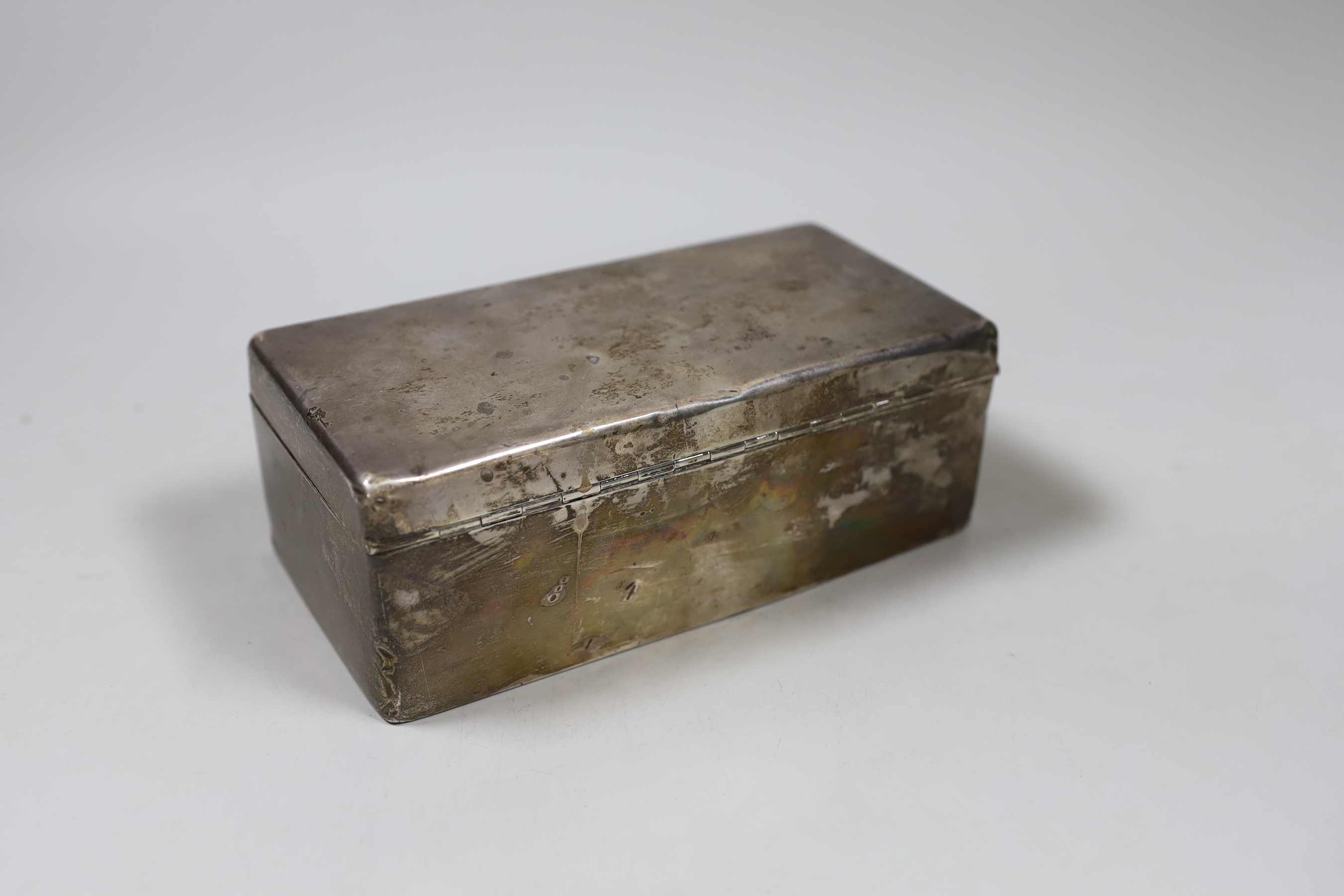 A George V silver mounted cigarette box, with engraved inscription, Birmingham, 1925, 17.5cm.